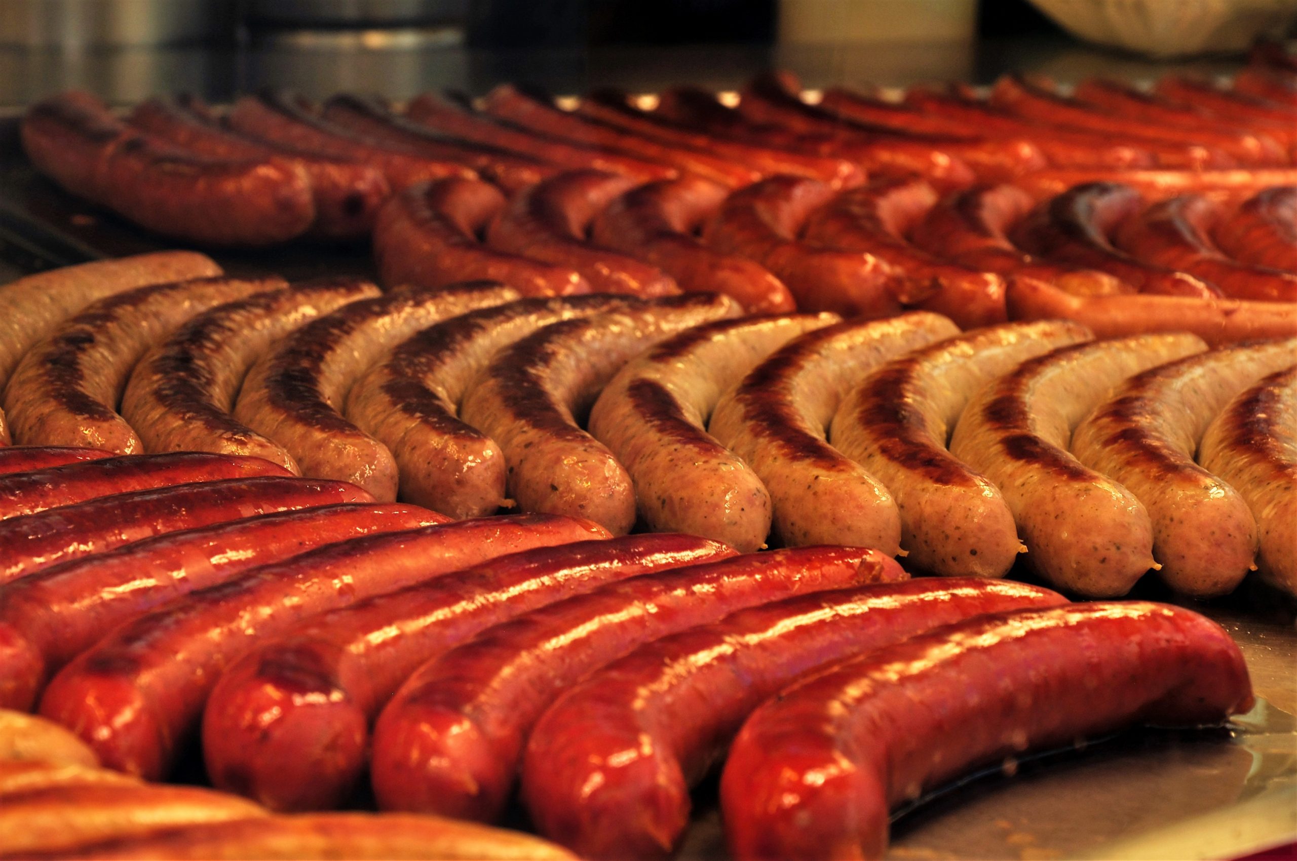 lots of sausages on bbq