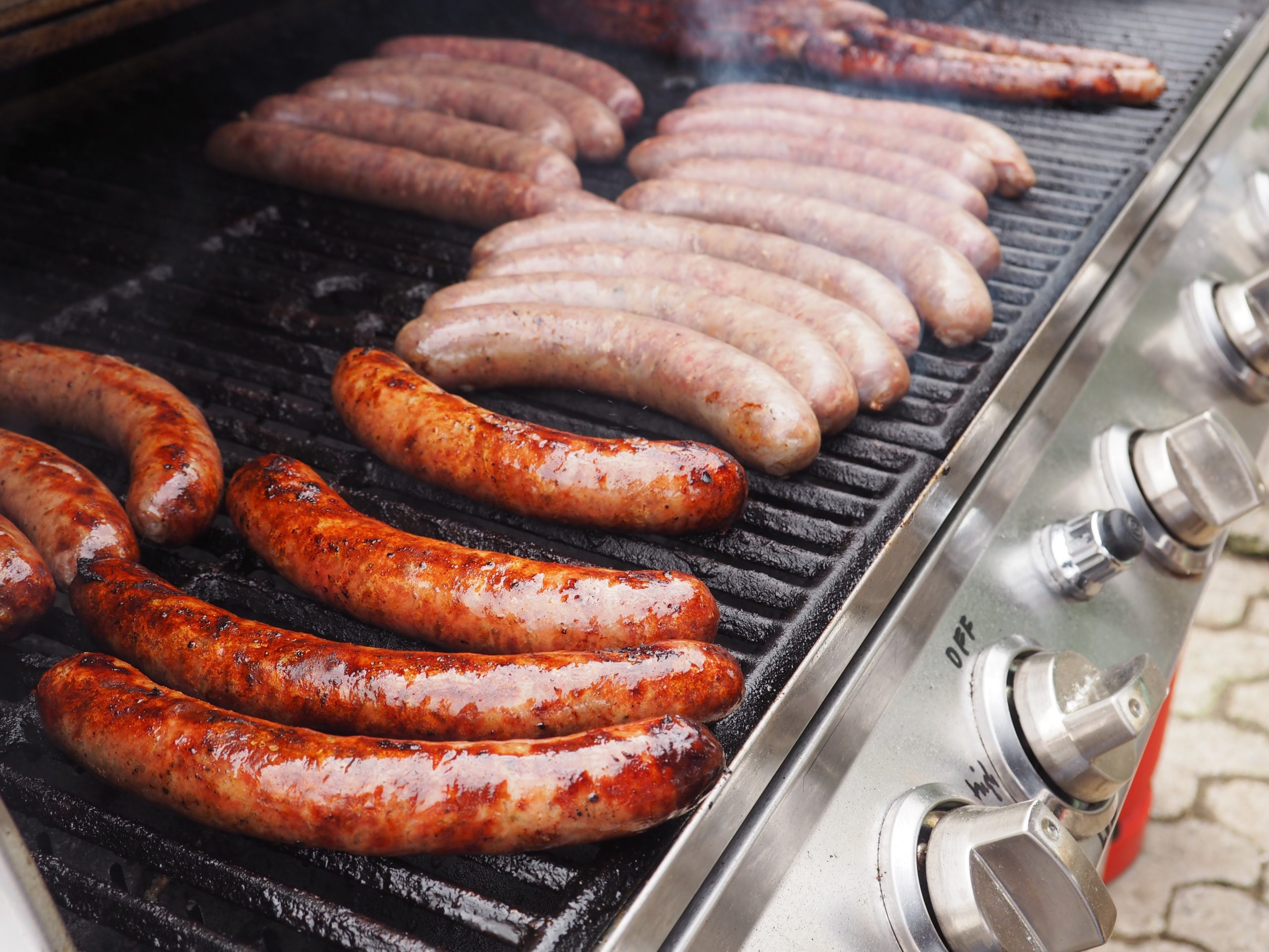Various german sausages on a gas bbq
