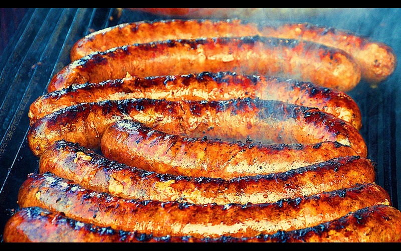 lots of sauages on bbq