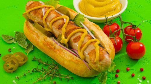 Bratwurst in a bun and mustard plus decoration