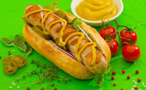 Bratwurst in a bun and mustard plus decoration