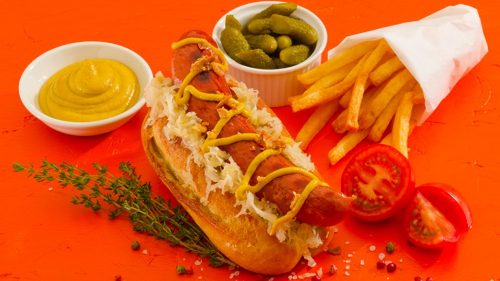 Vienna Beef Frankfurter in a bun with chips and decoration