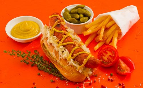 Vienna Beef Frankfurter in a bun with chips and decoration