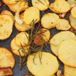 Golden bratkartoffeln potatoes pan-fried with onions and rosemary — traditional German fried potatoes compared to roasted potatoes in the UK