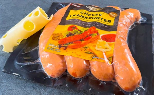 Pack of The Sausage Haüs Cheese Frankfurters, the authentic Austrian Käsekrainer, made with premium pork and Emmental cheese, available at Farmfoods in the UK.