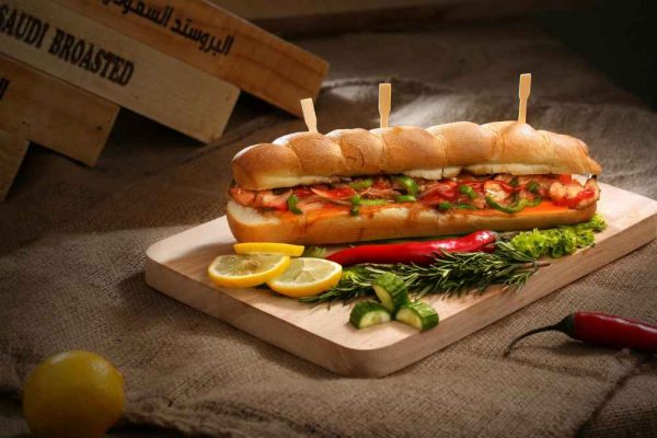 Is hotdog a healthy food? A fully loaded hotdog with peppers, relish and sauce in a long bun